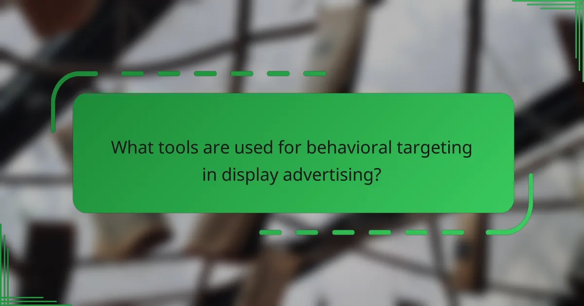 What tools are used for behavioral targeting in display advertising?